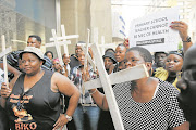 Family members of psychiatric patients who died earlier this year hold an ‘Esidimeni 37’ prayer vigil outside Gauteng Health MEC Qedani Mahlangu’s offices yesterday. The 37 patients died after being transferred from Life Esidimeni into the care of NGOs. Findings of the investigation into the tragedy would be released next month, health ombudsman Professor Malegapuru Makgoba said. Picture Creditc: Antonio Muchave. ©Sowetan