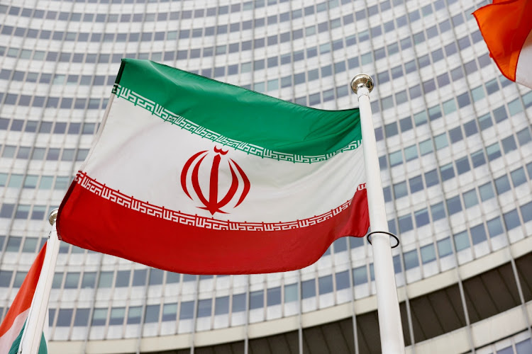 The Iranian flag waves in front of the International Atomic Energy Agency headquarters in Vienna, Austria. File photo: REUTERS/LEONHARD FOEGER