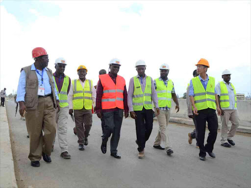 Transport CS James Macharia (with red reflector) on Wednesday said construction of the second container terminal at the Mombasa port, the ongoing construction of Airport Road and the SGR will be “game changers”./VICTOR IMBOTO