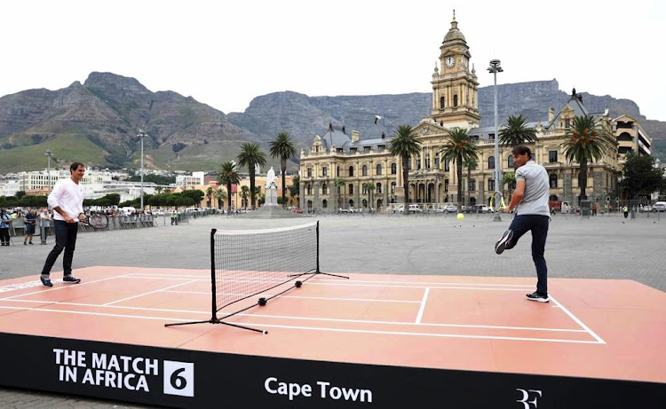 Roger Federer and Rafael Nadal lark about on the Grand Parade in Cape Town on February 7 2020.