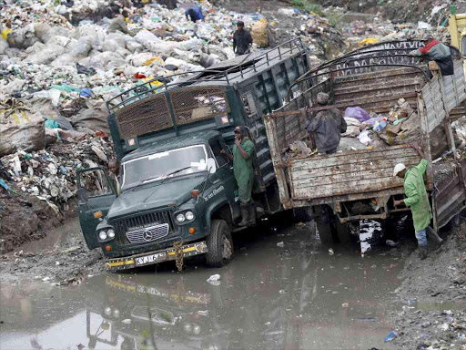 Trucks transport garbage to the Dandora dumpsite on June 5 last year REUTERS/THOMAS MUKOYA