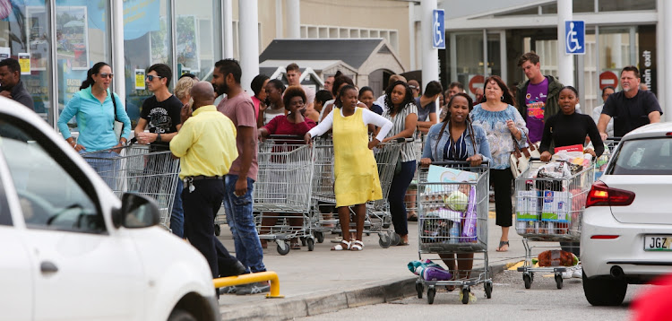 Shoppers at Makro load their trolleys ahead of lockdown.