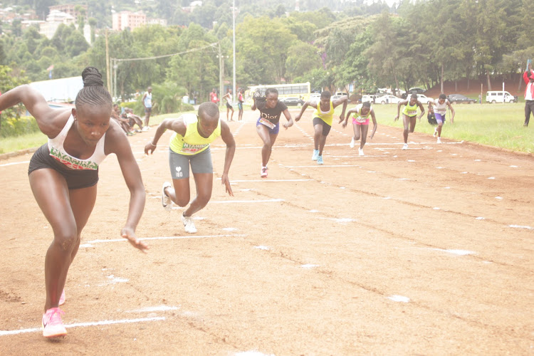 Athletes take off in the women's 200m race at Kisii University