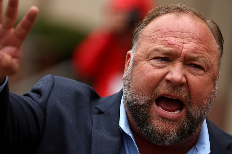 Infowars founder Alex Jones speaks to the media after appearing at his Sandy Hook defamation trial at Connecticut Superior Court in Waterbury, Connecticut, US, October 4, 2022.