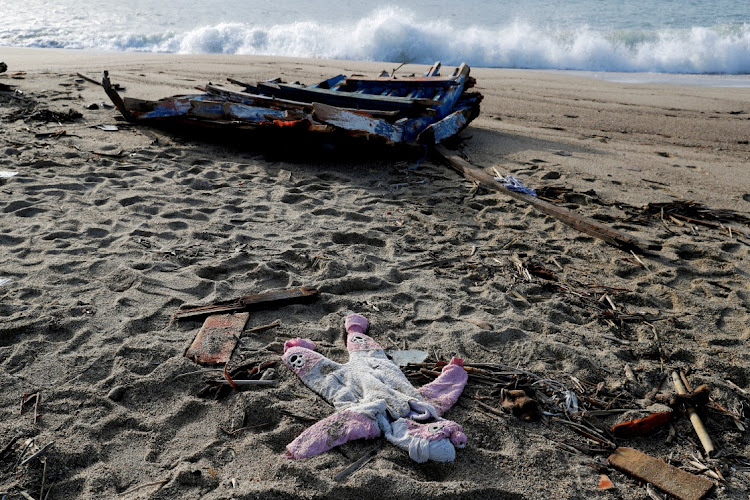 A piece of the boat and a piece of clothing from a eadly migrant shipwreck are seen in Steccato di Cutro near Crotone, Italy, in this February 28 2023 file photo. Picture: REMO CASILLI/REUTERS