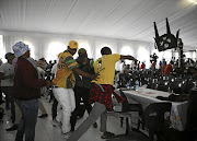 A member of the Congress of the South African Students throws a chair a he Higher Education National Convention in Midrand.