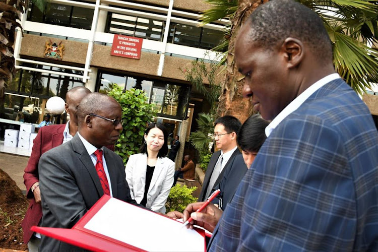Health Ministry acting director general Patrick Amoth receives medical supplies from the Kenya- China Economic Association to help in the prevention of COVD-19 at Afya House in Nairobi on Friday February 21, 2020