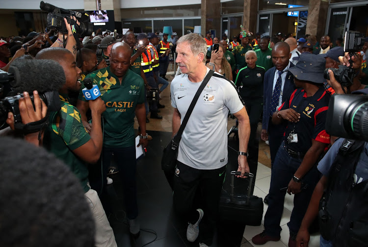 Bafana Bafana head coach Stuart Baxter with the team at OR Tambo International Airport.