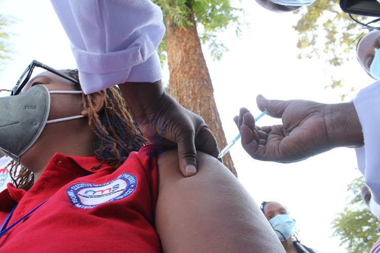 Vicky Maiyu, a health official, receives the Covid-19 vaccine at Mutuini Hospital, Dagoretti subcounty, on March 9, 2021.