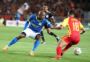 Khuliso Mudau of Mamelodi Sundowns is challenged by Houssam Ghacha of Esperance Tunis in their Caf Champions League semifinal first leg match at Stade Olympique Hammadi Agrebi in Rades, Tunisia on Saturday night.