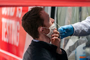 A man takes a coronavirus disease (Covid-19) test at a pop-up testing site in New York City, US, December 16 2021. 