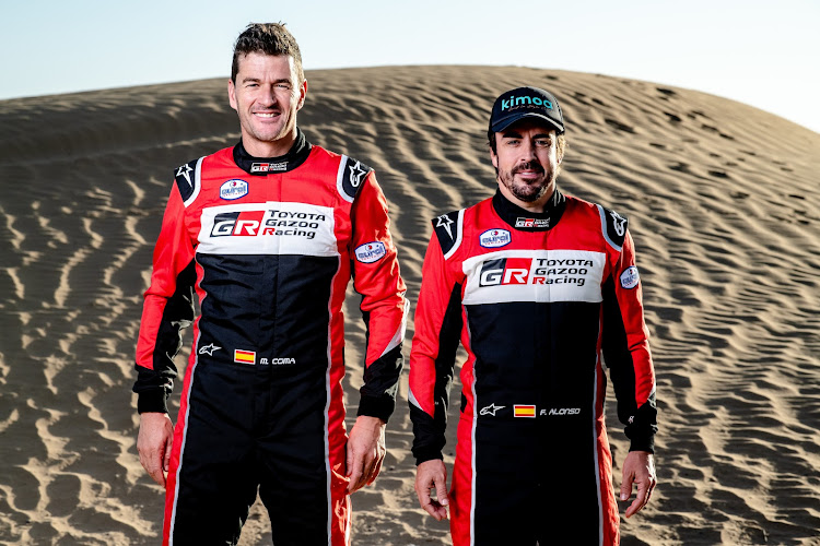 Former F1 champion Fernando Alonso, right, will take on next month's Dakar Rally with navigator Mark Coma. Picture: SUPPLIED