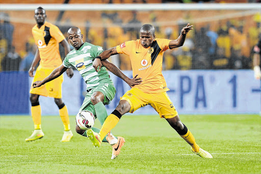 PUSHING AND SHOVING: Ruben Cloete of Bloemfontein Celtic and Willard Katsande of Kaizer Chiefs fight for ball possession during their teams' Absa Premiership match at FNB Stadium last night. Chiefs won 1-0