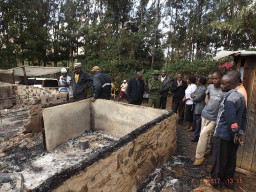 Residents of Ngare Ndare in Meru at a house where five family members perished in an inferno on Wednesday, May 3, 2017. /DENNIS DIBONDO