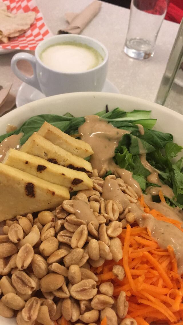 Thai bowl with peanut sauce and a Matcha Latte