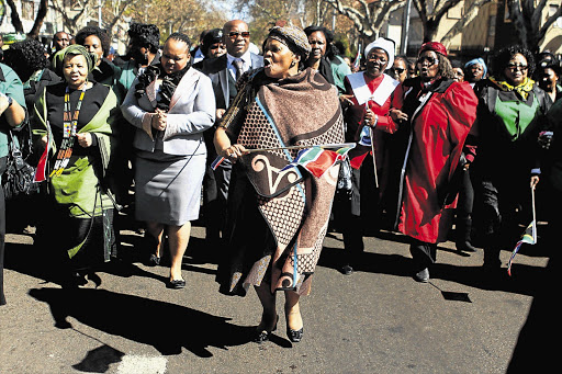 Premier of Gauteng Nomvula Mokonyane, first lady Nompumelelo Ntuli and Minister for Women, Children and People with Disabilities Lulu Xingwana lead a march from Lillian Ngoyi Square to the Union Buildings in Pretoria yesterday in commemoration of the 1956 women's march against pass laws