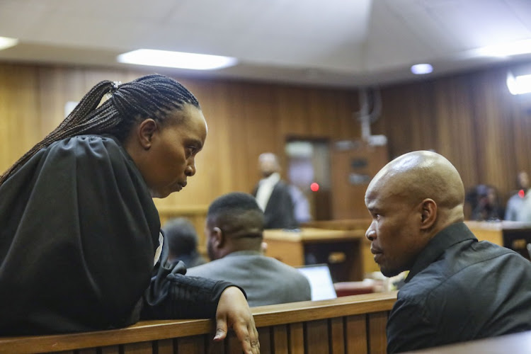 Advocate Zandile Mshololo consulting with an accused during the Senzo Meyiwa murder trial at the Gauteng high court in Pretoria. File photo.