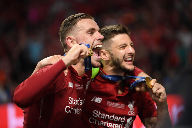 THRILLING VICTORY; Jordan Henderson and Adam Lallana of Liverpool celebrate after the Uefa Champions League final against Tottenham Hotspur at Estadio Wanda Metropolitano in Madrid on June 1 2019