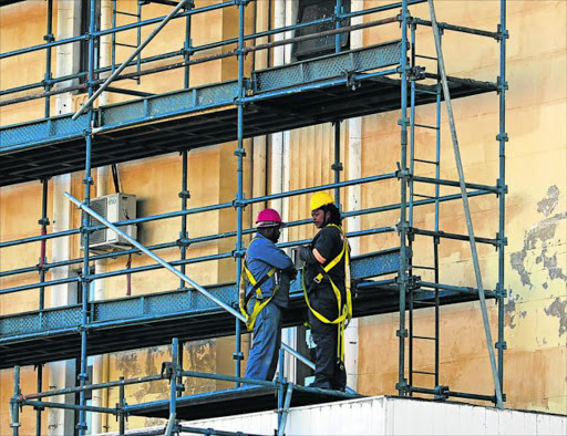RICKETY STRUCTURE: Scaffolding on Fleet Street and Oxford Street during a refurbishment at the BCM’s Munifin Centre deemed dangerous to workers and residents. The Department of Labour stepped in and halted all work until contractors met requirements Picture: BRANDON REYNOLDS
