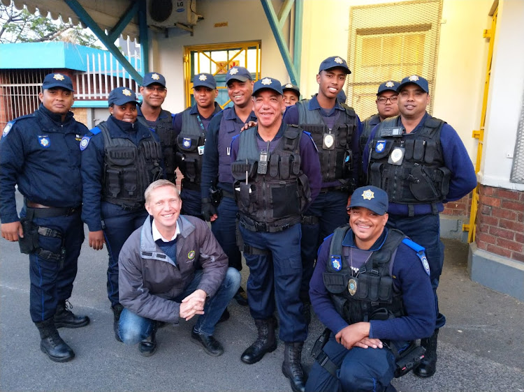 City of Cape Town mayoral committee member for safety and security JP Smith with members of the rail enforcement unit at Athlone station on September 18 2019.