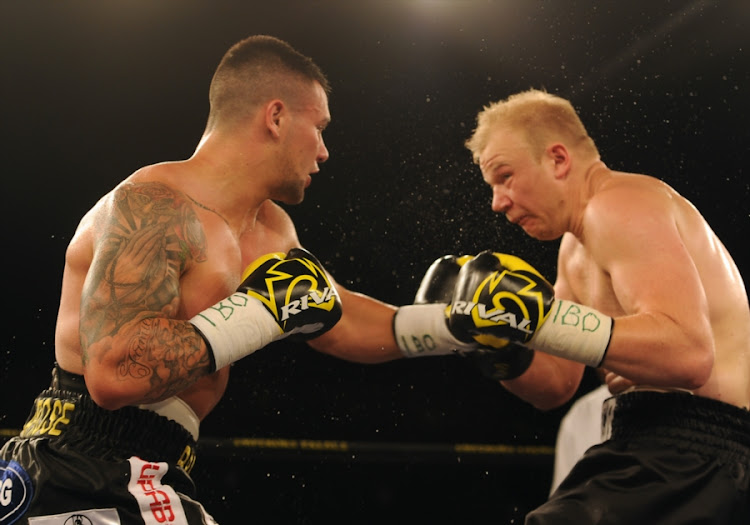 Kevin Lerena of SA (Black & Gold trunk) fighting Dmytro Kucher of Ukrain (Black trunk) in the IBO world cruser weight title during the Palace Pandemonium boxing event at Emporers Palace on March 03, 2018 in Johannesburg, South Africa.