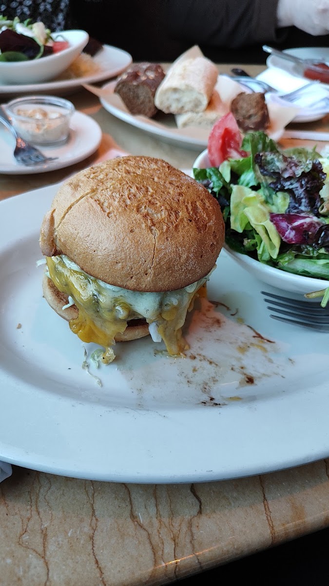 Gluten free cheeseburger with side salad.