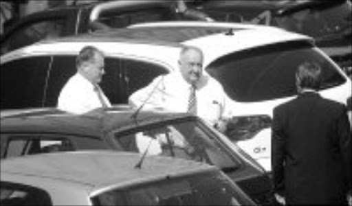 CALM: Alleged druglord Glen Agliotti, left, appeared briefly in the Johannesburg magistrates' court yesterday. Pic. Veli Nhlapo. 25/01/2007. © Sowetan.