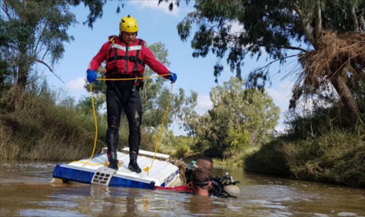 Police divers recovered a police van protruding above the surface of Sand River. A decomposed body was found in the vehicle Picture: South African Police Service via Facebook