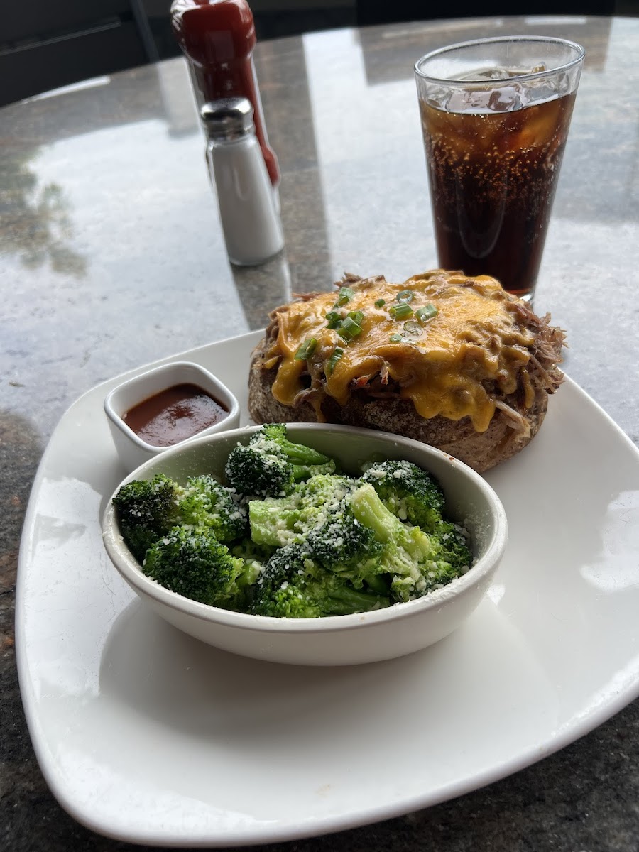 Pulled pork baked potato and their signature garlic broccoli side