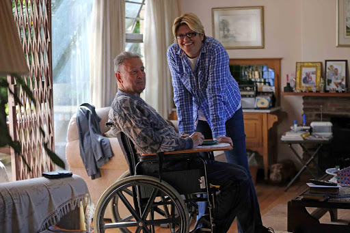 SHOWING PATIENCE: Caregiver Ronel Crous with her employer George Lord, who is wheelchair-bound due to a stroke Picture: ALAN EASON