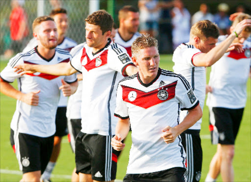 Germany's national soccer team player Bastian schweinsteiger (front) and his teammates attend a training session in the village of Santo Andre north of Porto Seguro June 18, 2014.