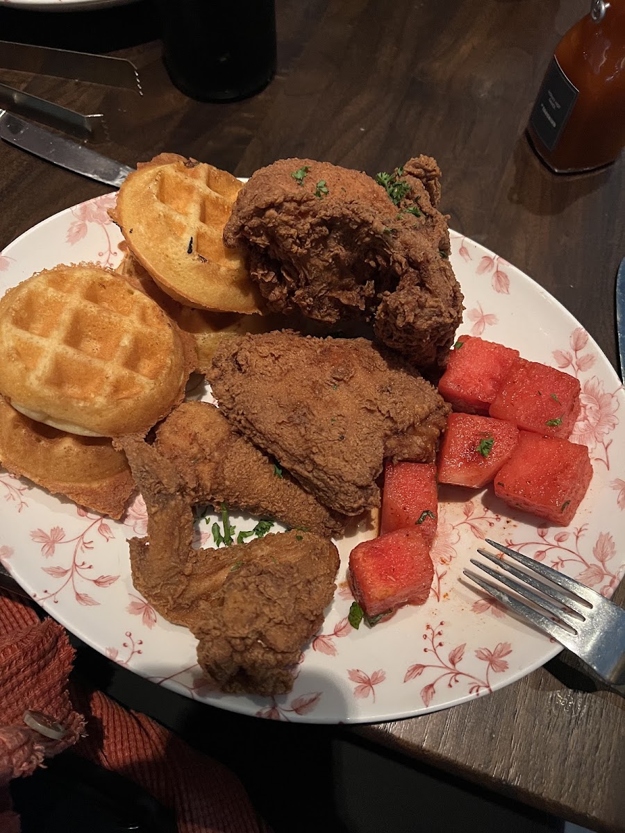 Gluten free chicken and waffles with watermelon. The gluten free waffles are round and done in a totally different waffle maker. The chicken also had a darker color and my husband said it tasted diff