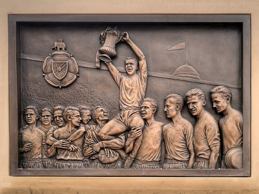 One of two commemorative plaques next to the statue of Nat Lofthouse at Bolton Wanderers' Reebok Stadium. This one shows Lofthouse holding the FA Cup after Wanderers' 2-0 victory in the 1958 Cup...