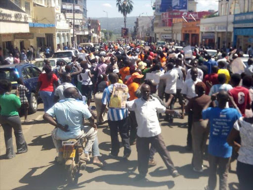 Kisumu residents celebrate after Gem Centra MCA Fred Ouda was issued ODM's nomination certificate, April 28, 2017. /FAITH MATETE