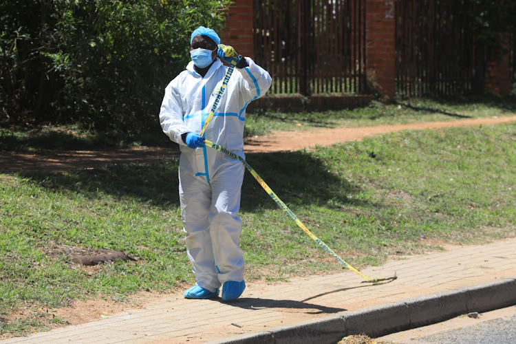 Forensic officers combed the scene for evidence outside the Randburg magistrate's court after two people were shot dead on Wednesday.