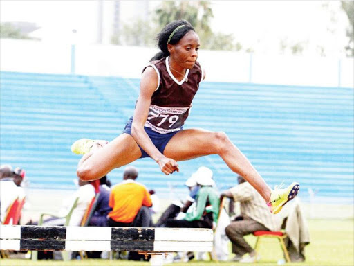 Beatrice Chepkoech clears a barrier during the 3000m steeple chase final at Nyayo Stadium. /ENOS TECHE