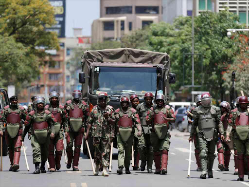 Riot policemen walk along a street in an attempt to disperse NASA supporters during a protest along a street in Nairobi, October 16, 2017. /REUTERS