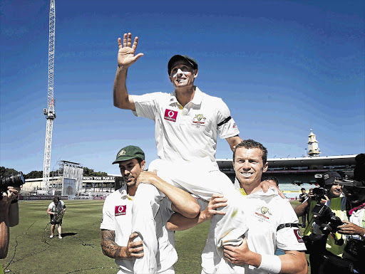 Australia's Mitchell Johnson and Peter Siddle carry team-mate Mike Hussey off the Sydney Cricket Ground at the end of his last Test match yesterday Picture: TIM WIMBORNE/GALLO IMAGES