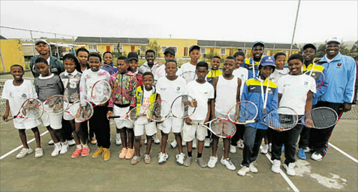 Youth from Mthatha villages are excited to be among the students of the Dan Pasiya Tennis Academy who graduated this week. With them are their coaches Picture: LULAMILE FENI