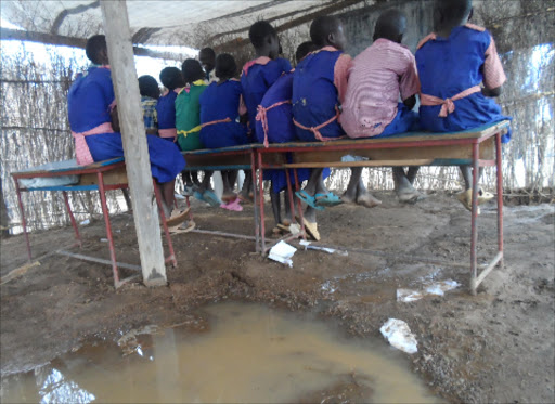 Pupils of Katuwit Primary School in Tiaty subcounty. Their classrooms got flooded following heavy rains on Friday last week