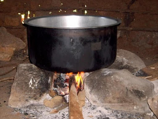 A sufuria on a fire place. A man in Nairobi has been accused by his wife of urinating on food being prepared for the family.