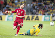 TOE-TO-TOE: Bafana Bafana's Daylon Claasen takes on Sergio Ramos of Spain during the sides' friendly match at FNB Stadium, Johannesburg, last night. South Africa won 1-0 Picture: