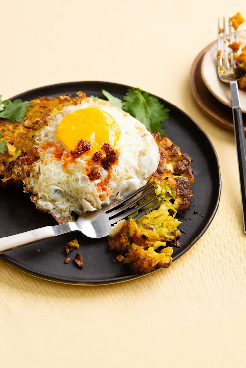 Potato and cabbage hash cakes with fried egg.