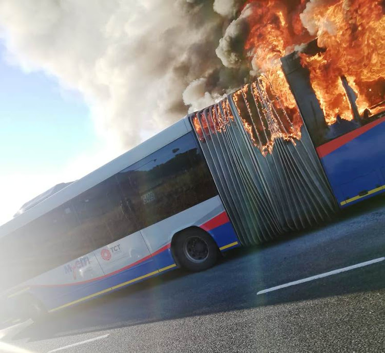 The fire spreads from the rear engine compartment to the rest of the bus on Hospital Bend in Cape Town on April 25 2019.