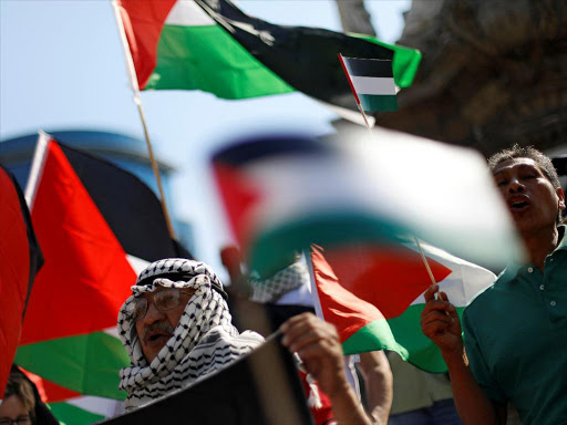 Pro-Palestinian protesters take part in a demonstration to protest against the US embassy move to Jerusalem and ahead of the 70th anniversary of Nakba, at the Angel of Independence monument in Mexico City, Mexico May 14, 2018. /REUTERS