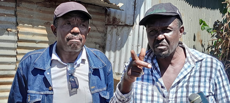 Eldoret traders Stephen Mugwira (R) and Njuguna WaMwiko speaking in Eldoret town on April 16, 2024