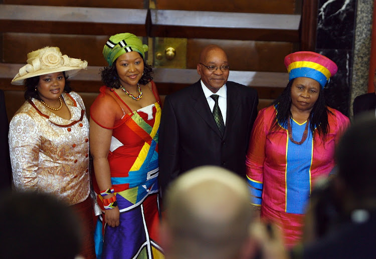 Jacob Zuma poses for photographs with his three wives Sizakele Khumalo, Nompumelo Ntuli and Thobeka Madiba.