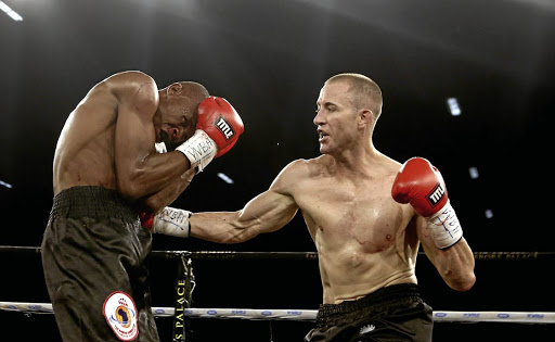 Boyd Allen lands a punch on John Bopape to later win the WBA Pan African junior middleweight title.