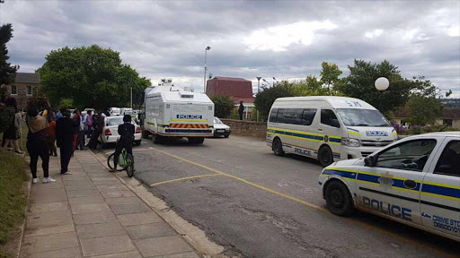 Police vehicles parked outside the Rhodes University's main building Picture: DAVID MACGREGOR