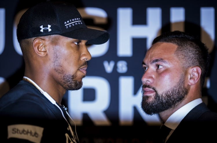 Anthony Joshua and Joseph Parker square up during an Anthony Joshua and Joseph Parker Press Conference at the Dorchester Hotel on January 16, 2018 in London.